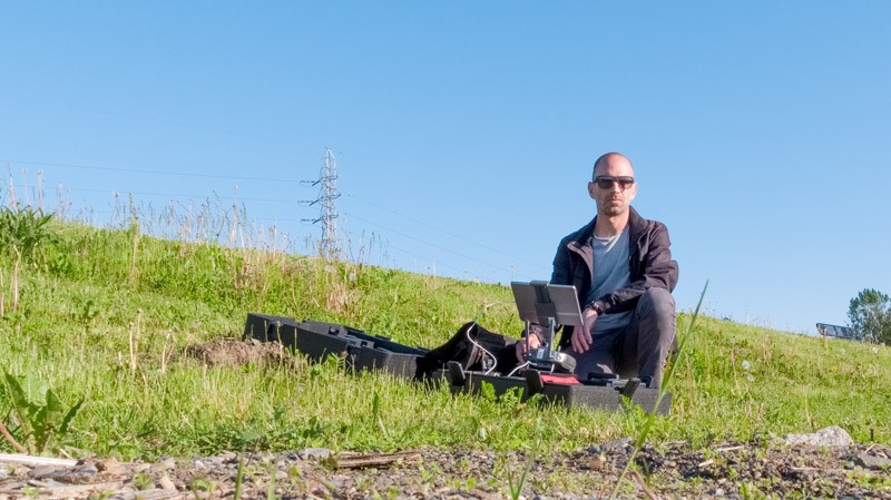 Adrian Fish, a photo-based artist and educator, flying a drone in Halifax, N.S.