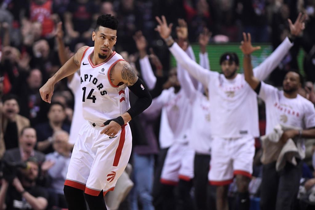 Toronto Raptors guard Danny Green (14) reacts after making a three-pointer against the Golden State Warriors during first half basketball action in Game 1 of the NBA Finals in Toronto on Thursday, May 30, 2019.