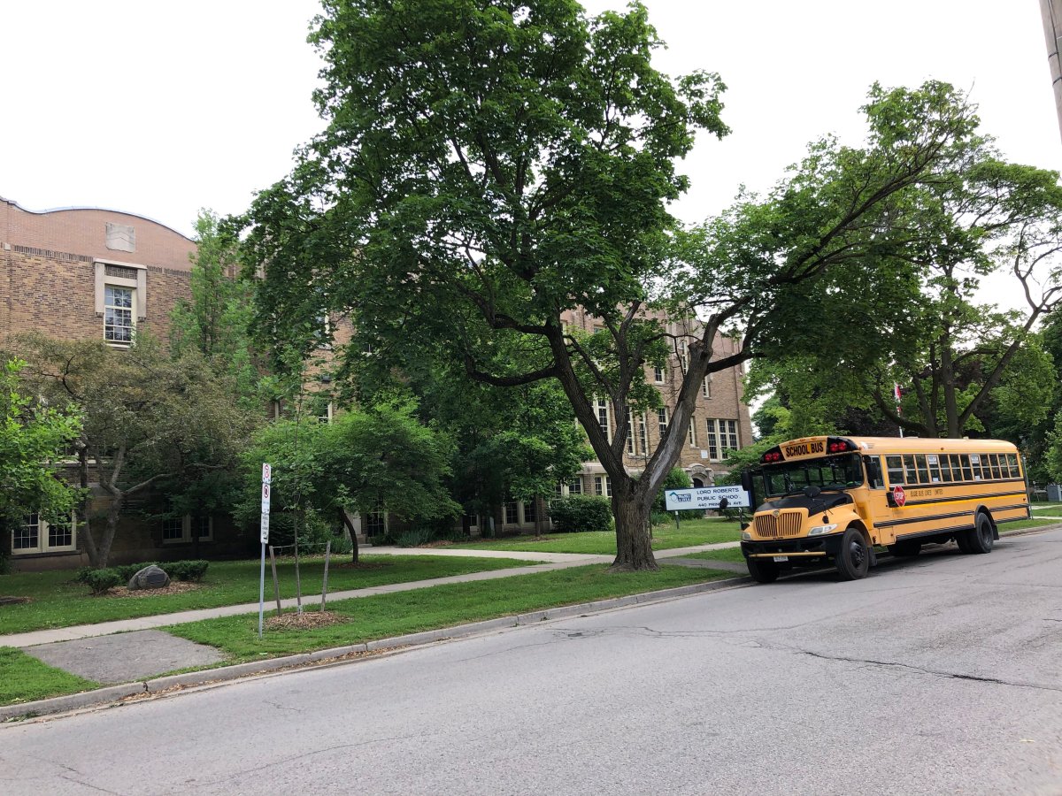A school bus waits outside Lord Roberts French Immersion Public School on the last day before summer vacation.