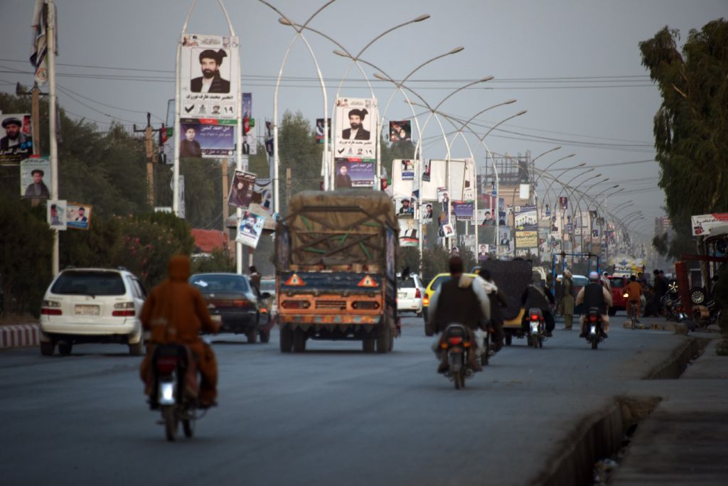 Posters of candidates are pictured along a road ahead of legislative election in Kandahar province on October 26, 2018.