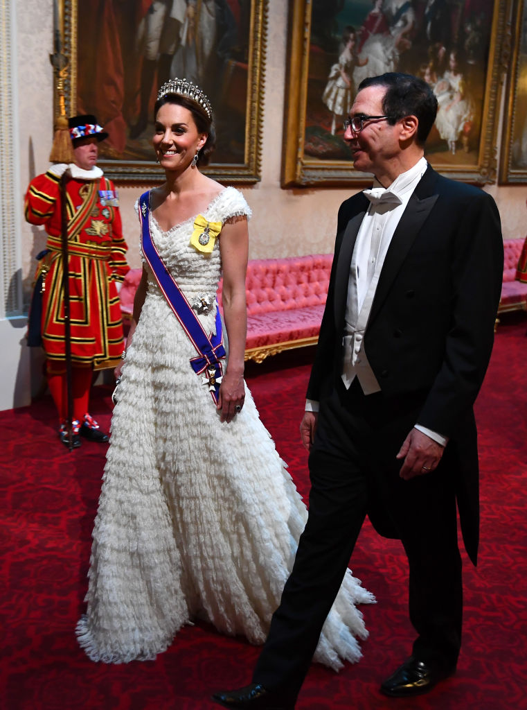 The Duchess of Cambridge and United States Secretary of the Treasury Steven Mnuchin arrive through the East Gallery for a state banquet at Buckingham Palace. Photo: Getty Images.