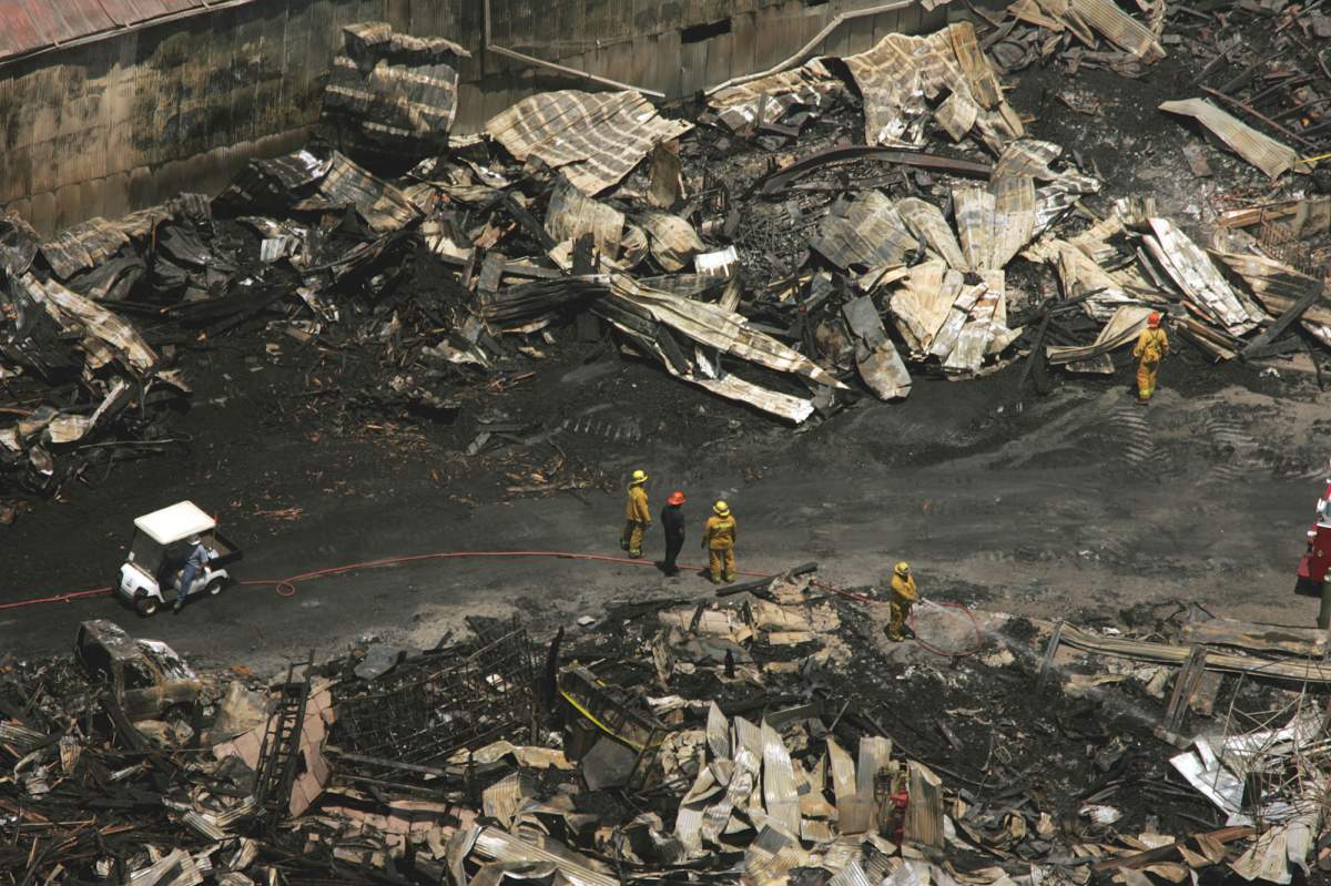 Aerial view as firemen spray water on part of the backlot of Universal Studios on June 2, 2008. The fire, which broke out Sunday, June 1, burned out sites on 3 1/2 acres of the 391 acre property.