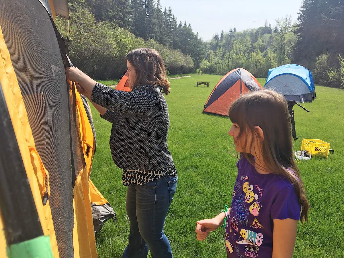 Shannon and Payten McBee set up tents.