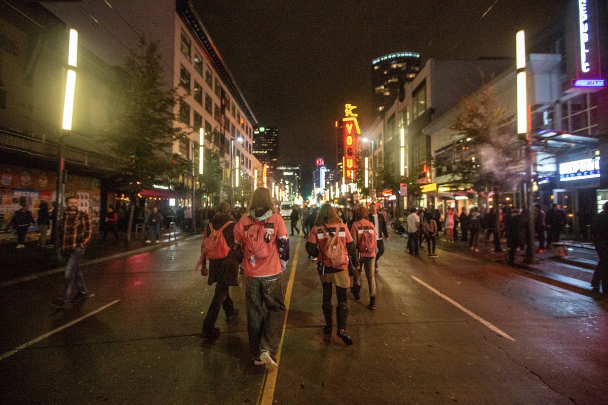 Good Night Out's pink-shirt-clad street team walks the Granville Strip in this undated photo.
