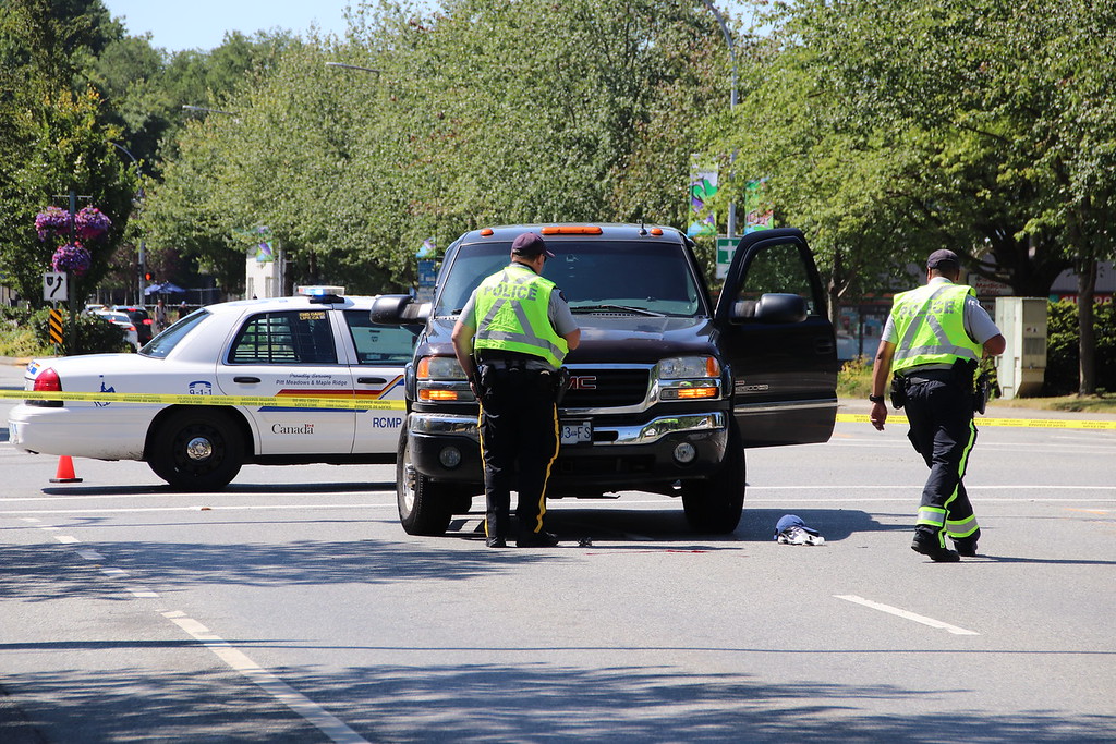 Police investigate the scene of a collision between a truck and a pedestrian in Pitt Meadows on Sunday, June 30, 2019.