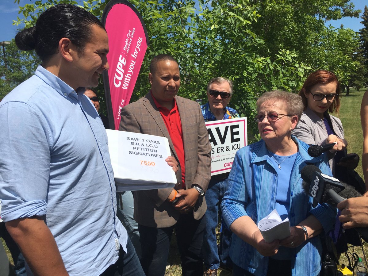 Helen Zacharkiw speaks with Wab Kinew outside the Seven Oaks Hospital.