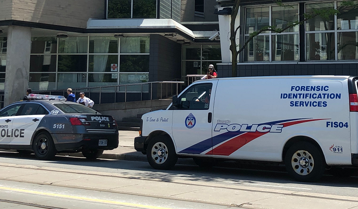 Toronto police on scene investigating after a man was found dead in a building near Moss Park Thursday morning.