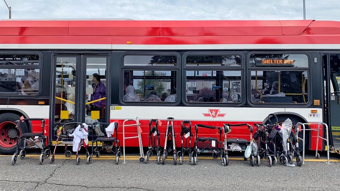TTC buses have been brought in to provide shelters for displaced residents from a three-alarm fire Monday.