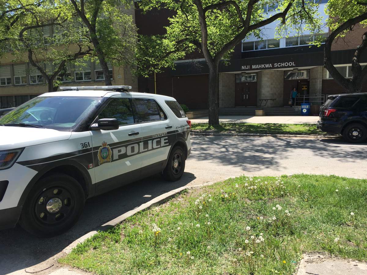 Police in front of Niji Makhwa School on Flora Avenue Wednesday.