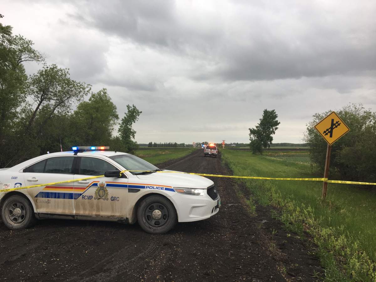 An RCMP cruiser blocks the road near Oakbank Sunday, June 16, 2019.
