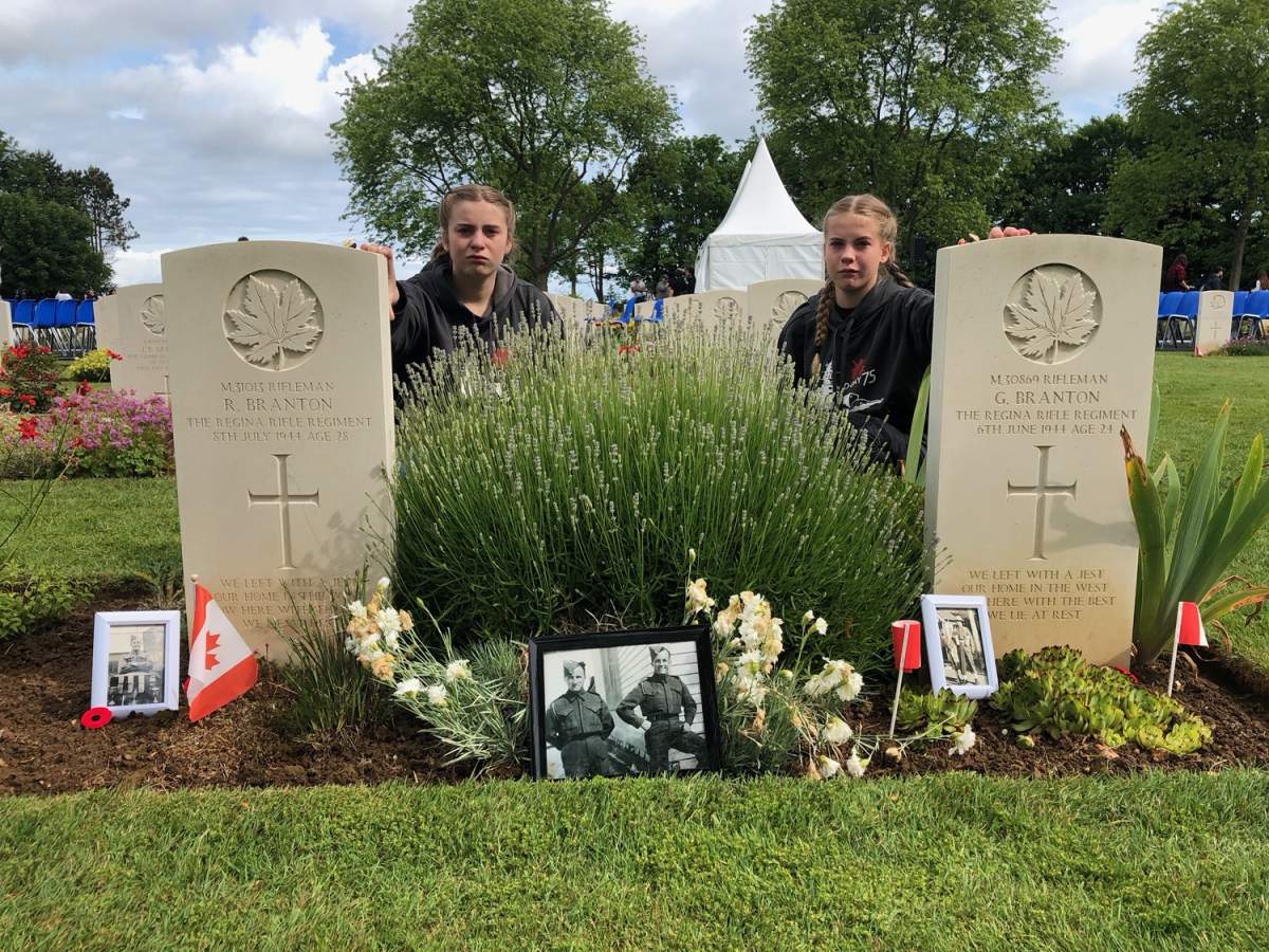 Sea cadets Brook and Amanda Hanik at the graves of Ronald and Gordon Branton, at the Beny-sur-Mer Canadian War Cemetery, Normandy.