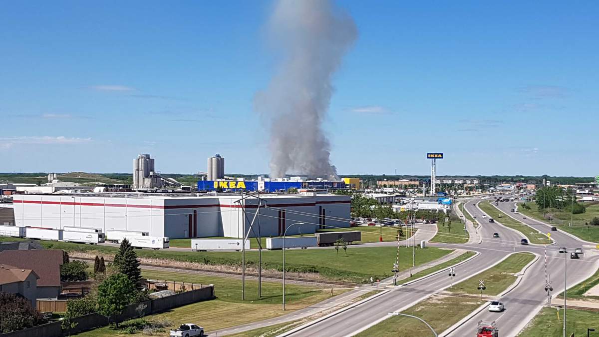 Smoke near the Seasons of Tuxedo complex Wednesday.