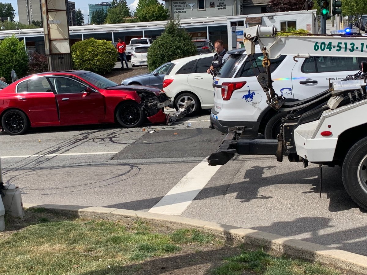 Two people were arrested Tuesday after a multi-vehicle crash involving a police cruiser and an allegedly stolen car. 