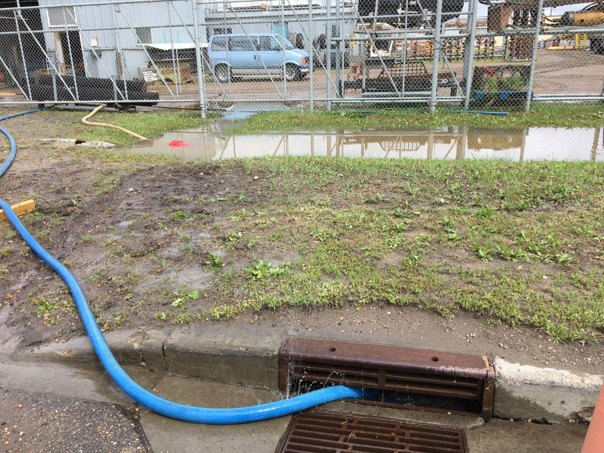 Scott Conrad with Phoenix Fence found five inches of water in his shop Thursday morning. June 20, 2019.