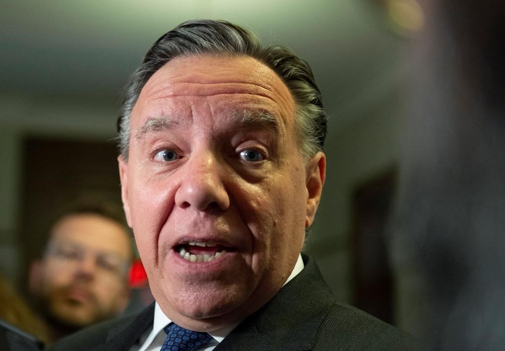 Quebec Premier François Legault responds to reporters' questions over his meeting with Alberta Premier Jason Kenney, Wednesday, June 12, 2019.