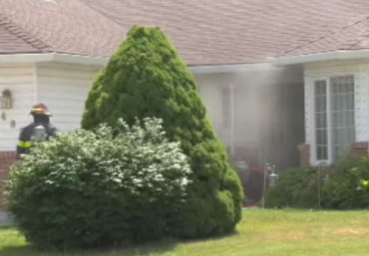 Smoke wafts from a home on Nelson Place in Kelowna after the fire fepartment extinguished a kitchen fire on Friday. 