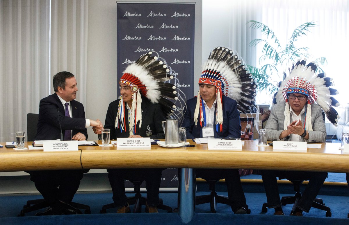 Alberta Premier Jason Kenney sits with Grand Chief Wilton Littlechild, left, Grand Chief Arthur Noskey, centre and Chief Aaron Young during a meeting with First Nations Chiefs and Grand Chiefs about increasing Indigenous participation in the economy, in Edmonton on Monday, June 10, 2019. 