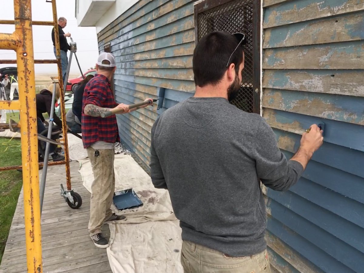 Volunteers help paint Lawrencetown Beach House in June 2019.