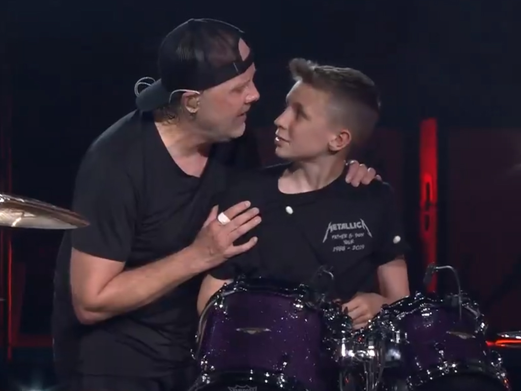 (L-R) Lars Ulrich, drummer of Metallica, with 13-year-old Evan Adamson, during Metallica's gig at the Johan Cruyff Arena in Amsterdam, Netherlands, on June 11, 2019.