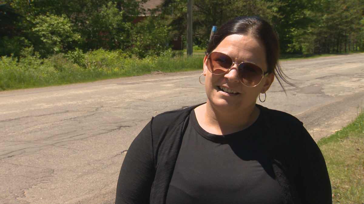Michelle Bannister, a volunteer firefighter, says she is considering moving after her vehicle was damaged on Route 905 and after she witnessed a near-accident with someone on a bicycle