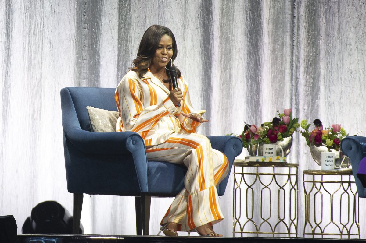 Former U.S. first lady Michelle Obama speaks on stage at Accor Hotel Arena in Paris on April 16, 2019 during a tour to promote her memoir 'Becoming.'.