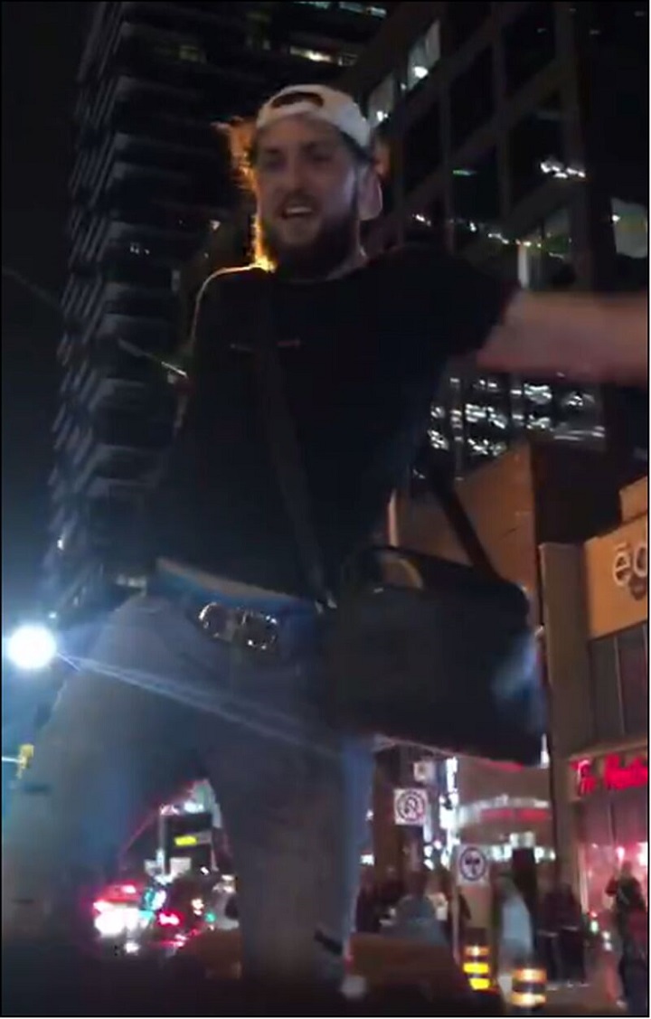 The suspect is described as between 25 and 35 years old, medium build, with brown hair and a brown beard. He was wearing a black T-shirt, blue jeans, a white baseball hat, bright yellow running shoes and carrying around a black shoulder bag.