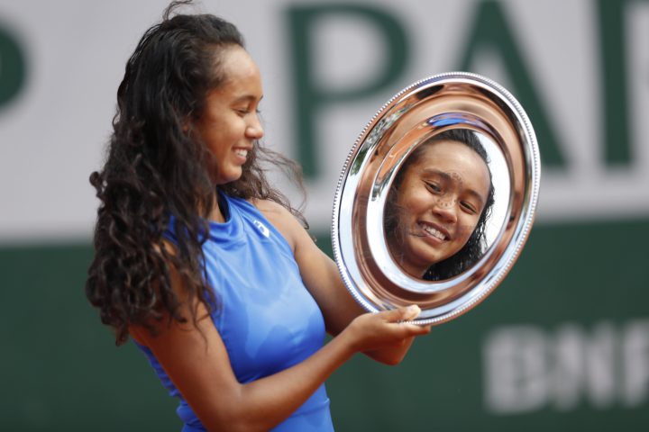 Canada's Leylah Annie Fernandez holds the trophy after winning the junior women's final match of the French Open tennis tournament in Paris on June 8, 2019.