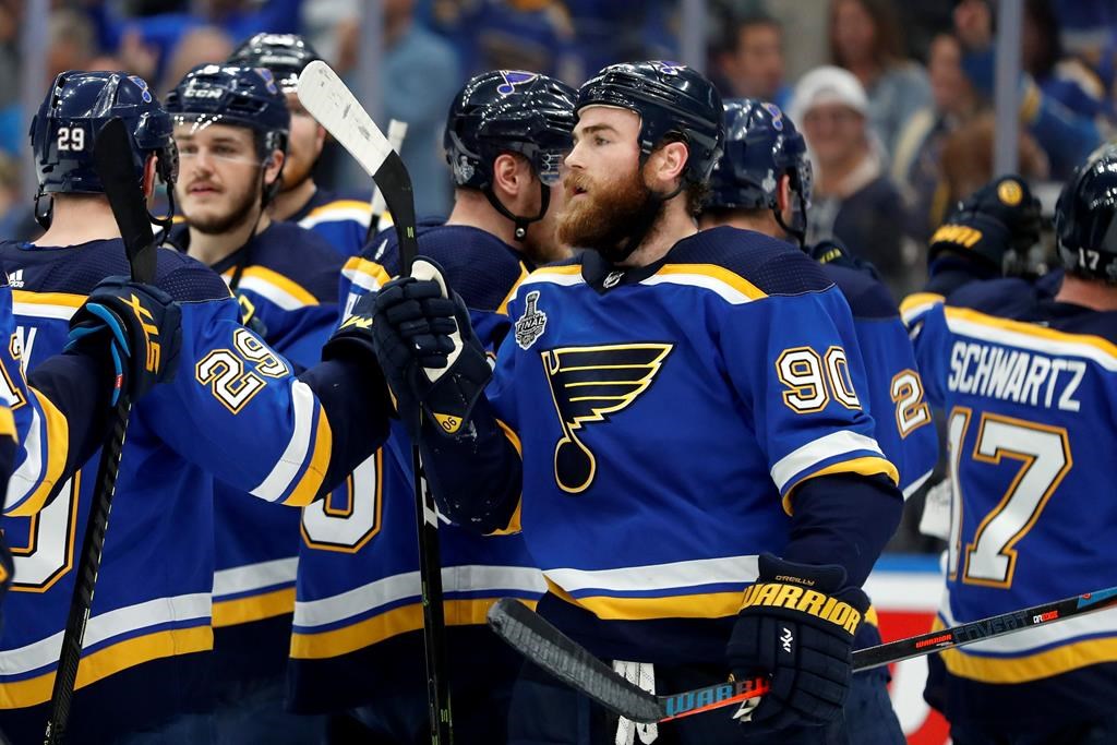St. Louis Blues center Ryan O'Reilly (90) celebrates after the Blues beat the Boston Bruins in Game 4 of the NHL hockey Stanley Cup Final Monday, June 3, 2019, in St. Louis. O'Reilly scored two goals as the Blues won 4-2 to tie the series 2-2. (AP Photo/Jeff Roberson).