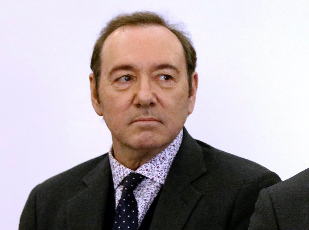 Actor Kevin Spacey stands in district court during arraignment on a charge of indecent assault and battery in Nantucket, Mass.