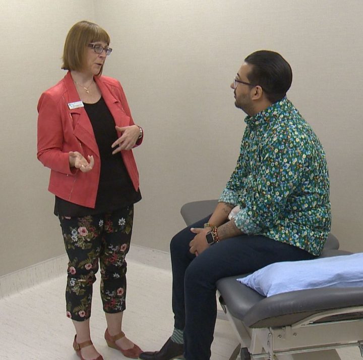 Dr. Lori Montgomery, medical leader of the Calgary Pain Program, talks to Shan Rahim, a patient receiving medically supervised opioid tapering, on June 10, 2019.