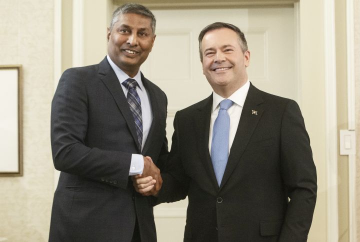 Alberta premier Jason Kenney shackles hands with Prasad Panda, Minister of Infrastructure after being sworn into office, in Edmonton on Tuesday April 30, 2019. 