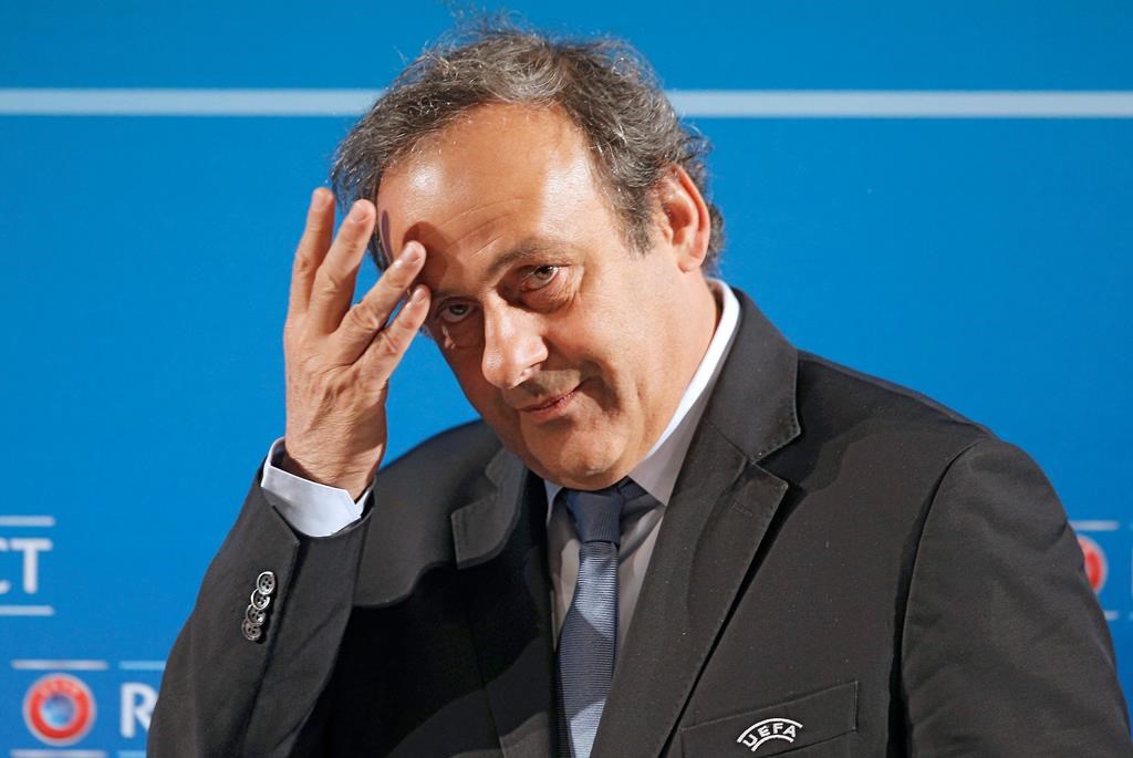In this Feb.22, 2014 file photo, UEFA President Michel Platini arrives at a press conference, one day prior to the UEFA EURO 2016 qualifying draw in Nice, southeastern France.
