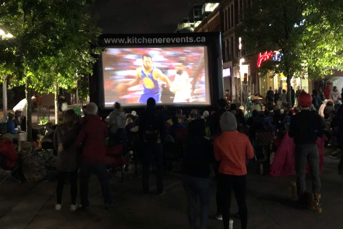 Fans braved the windy conditions on Monday to watch the Raptors on King Street in Kitchener.