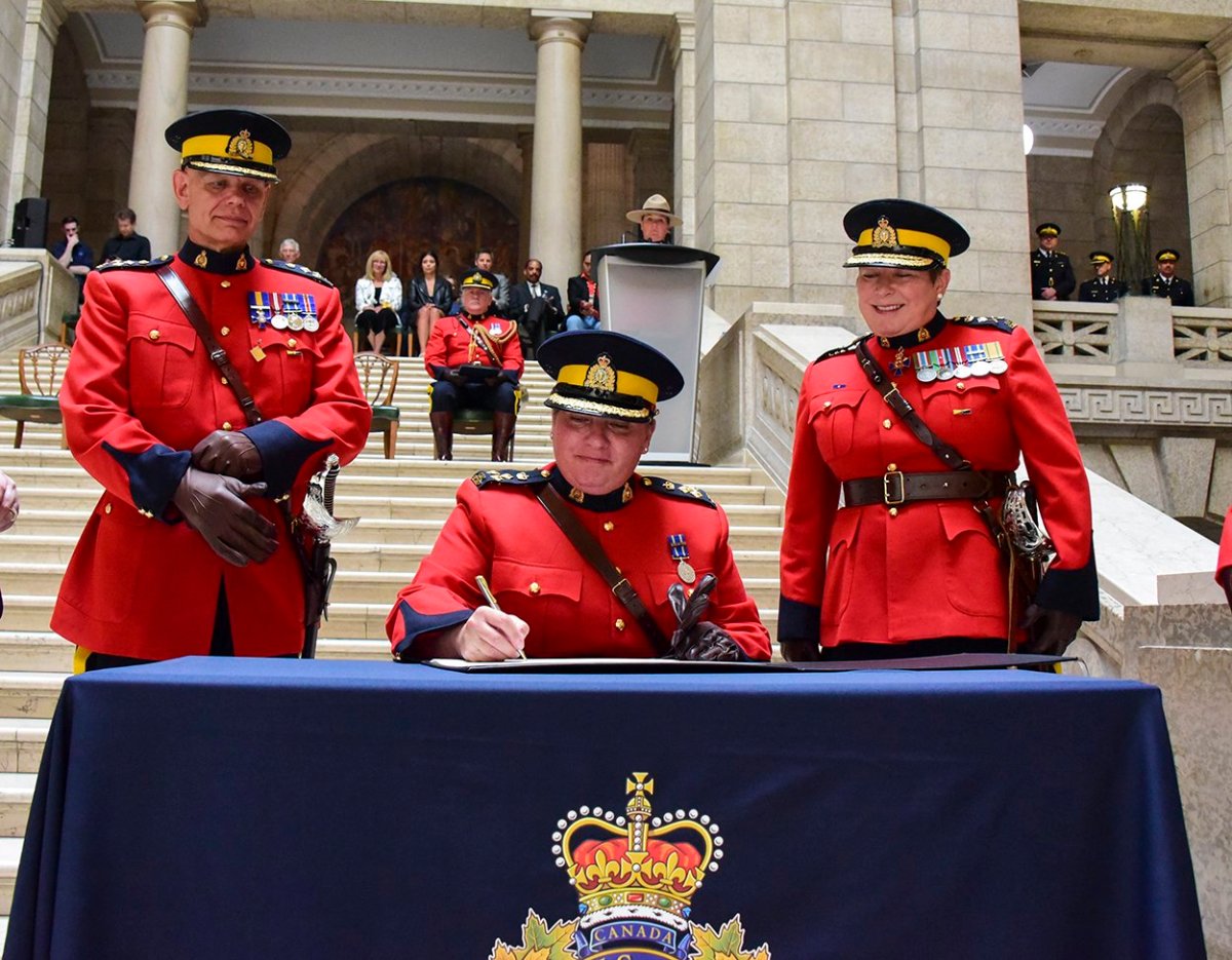 Assistant Commissioner Jane MacLatchy officially becomes the commanding officer of Manitoba's RCMP, as outgoing commander Scott Kolody and RCMP commissioner Brenda Lucki look on.