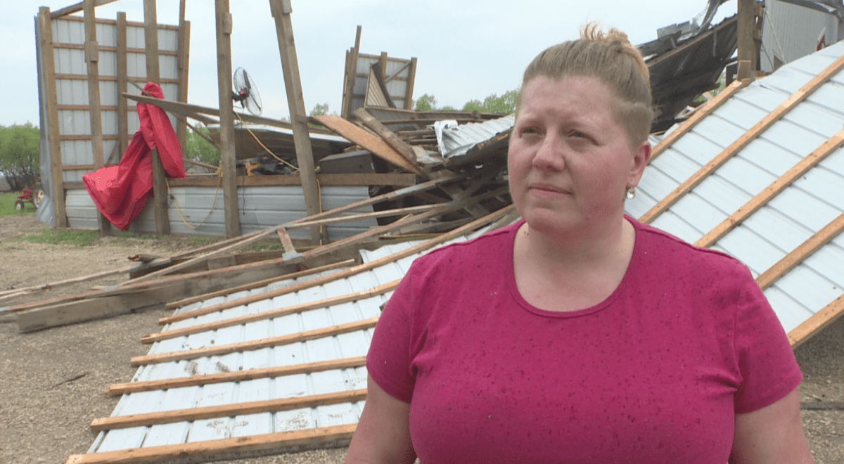 Melody Schwabe standing in front of what’s left of the Schwabe Pumpkins’ barn.