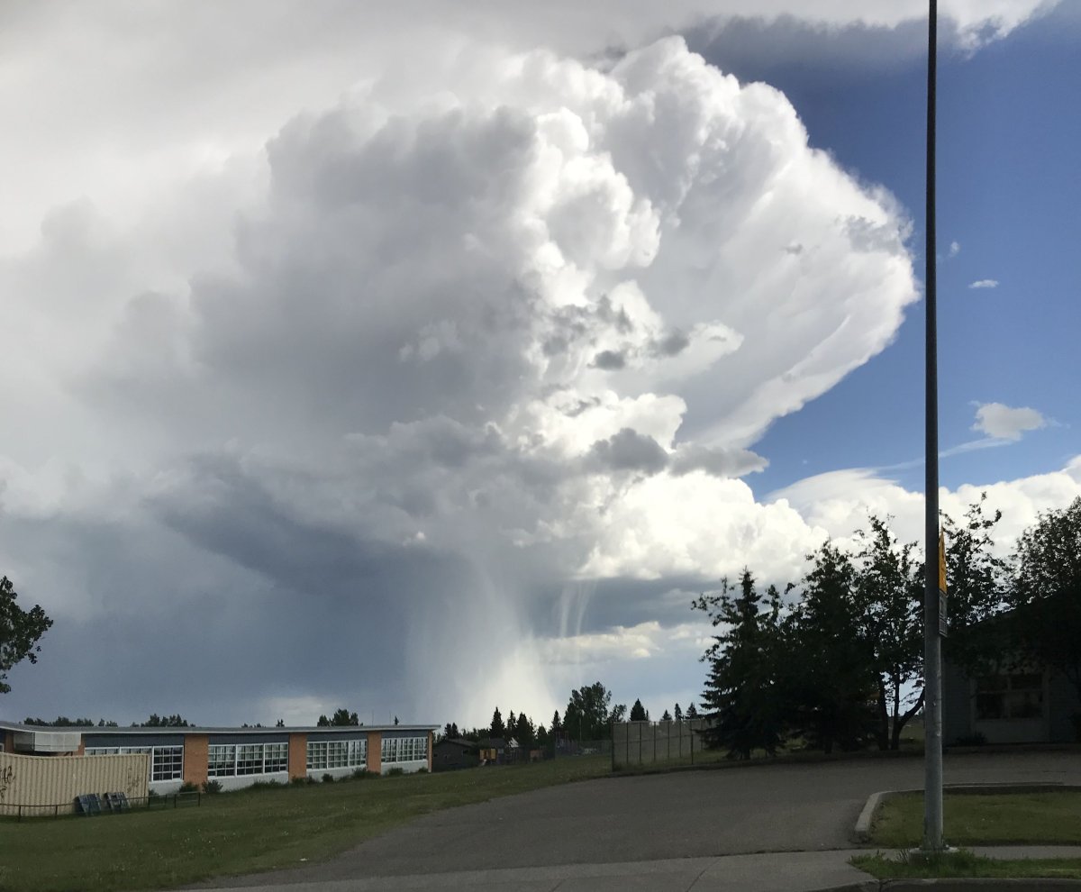 Photo of a cloudburst during a thunderstorm near Calgary, Alta. on Thursday, June 14, 2019. 
