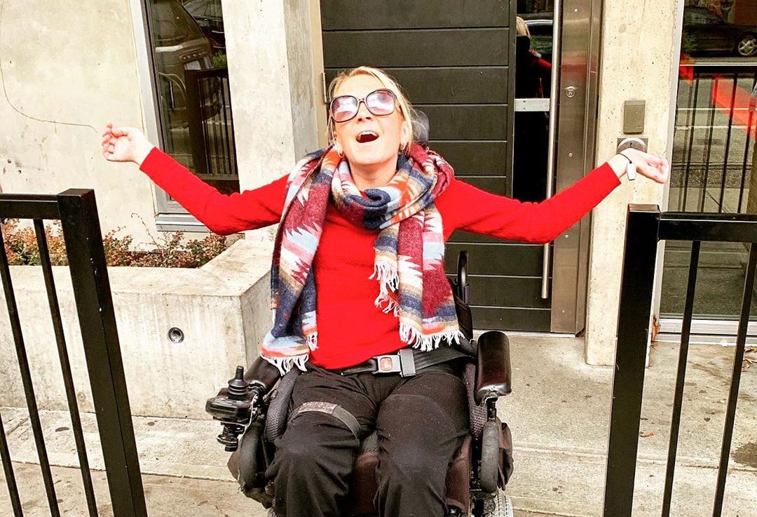 Shannon Elmer takes a breath of fresh air after finally escaping her apartment Friday, June 7, 2019. Elmer, who is confined to a wheelchair after a skiing accident four years ago, was trapped in her Gastown home for 12 days after the elevator in her building broke down.