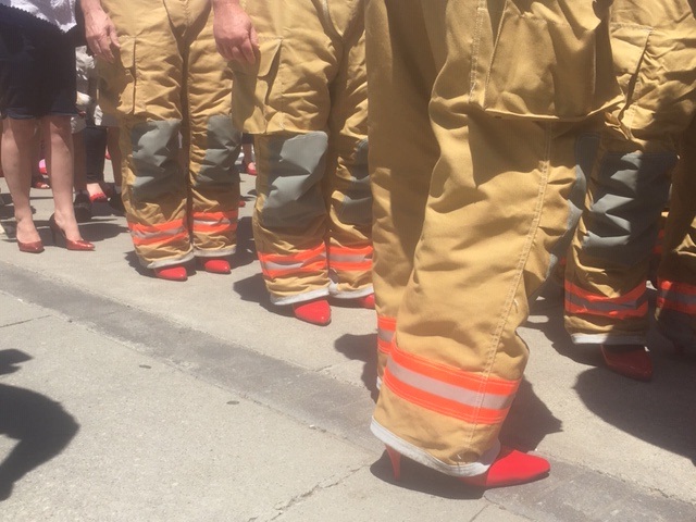 Hamilton firefighters were among those participating in the 10th annual Walk A Mile In Her Shoes fundraiser at city hall.