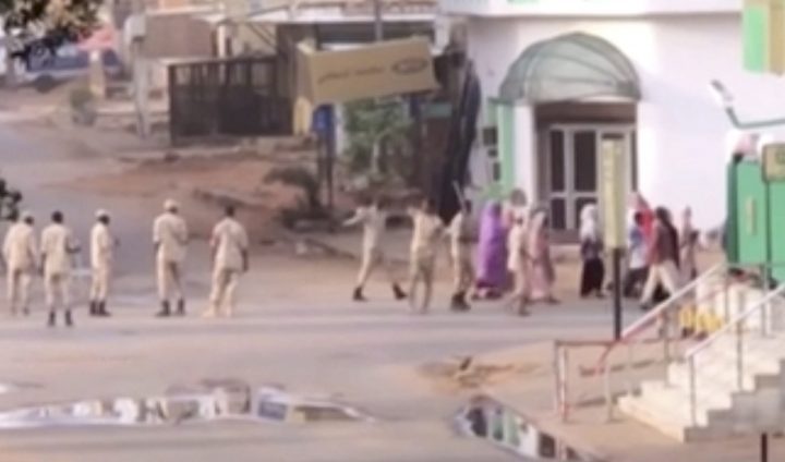 In this image made from video, Sudanese forces escort civilian in Khartoum, Sudan on Monday, June 3, 2019.