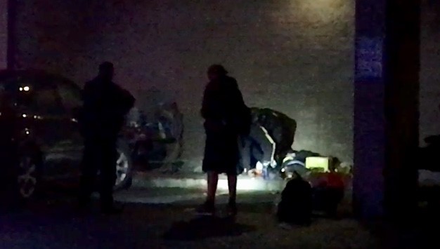 RCMP attend to a stabbing victim in downtown Kelowna on Thursday night.