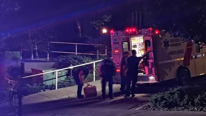 An ambulance in the area of Vernon's Centennial Drive where a man was stabbed in the arm Tuesday night. 