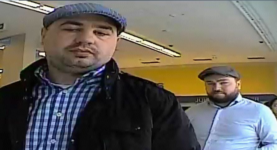 Kingston police are looking for these two men, who allegedly used a stolen credit card.