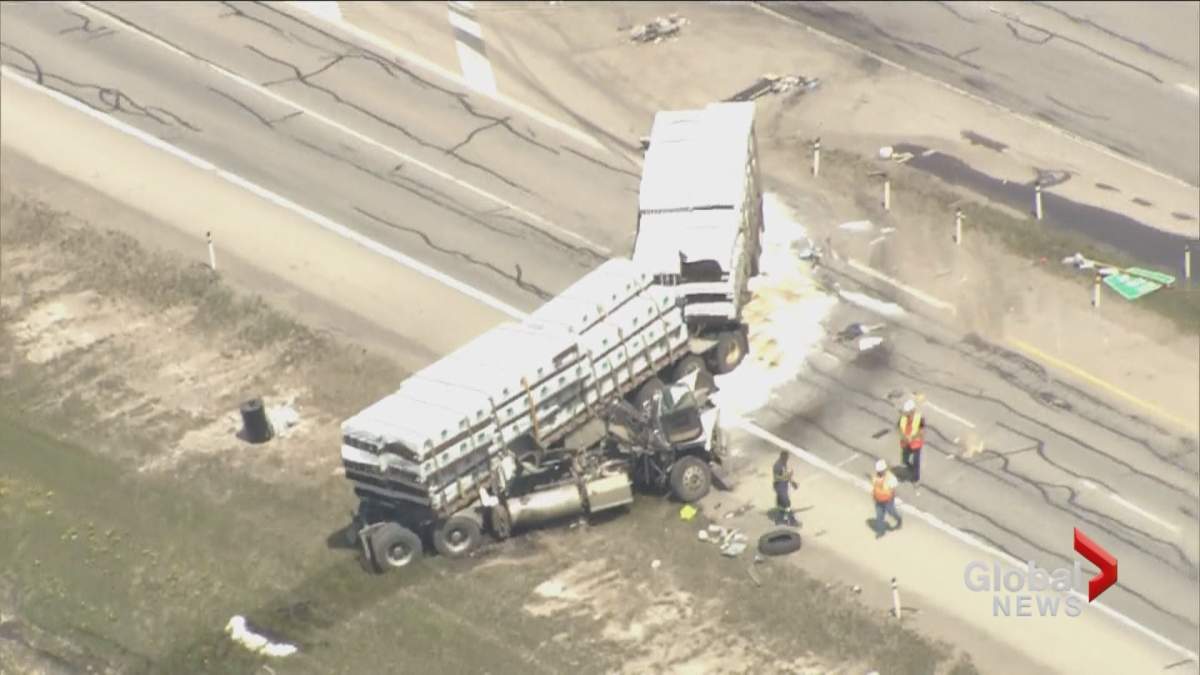 Cleanup crews seen at the site of a semi truck collision on Calgary’s Stoney Trail on Monday, June 3.