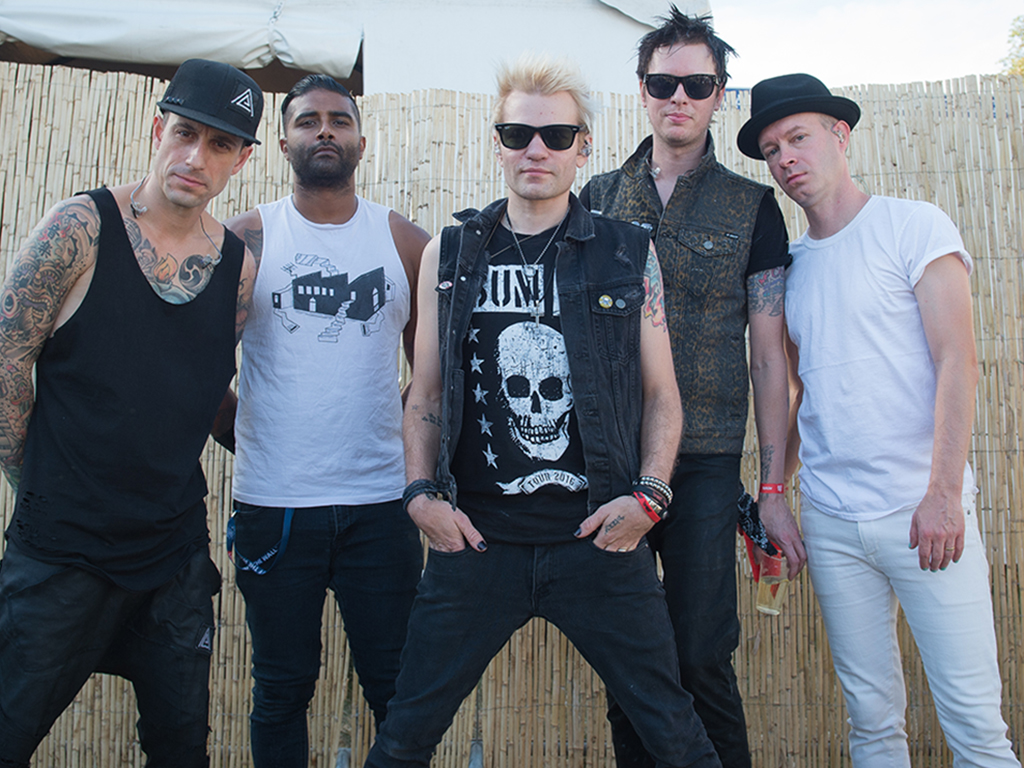 Sum 41: (L-R) Frank Zummo, Dave Baksh, Deryck Whibley, Jason McCaslin and Tom Thacker posing for a photo session at Rock en Seine on Aug. 28, 2016 in Paris, France.