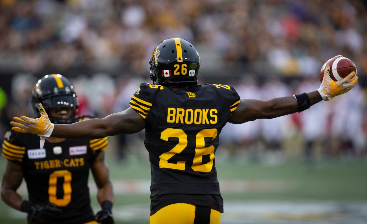 Hamilton Tiger-Cats defensive back Cariel Brooks (26) celebrates his interception during first-half CFL football game action against the Montreal Alouettes in Hamilton, Ont., on Friday, June 28, 2019.