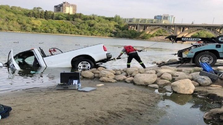 A truck towing a trailer slid into the South Saskatchewan River at the boat launch on Spadina Crescent in Saskatoon on June 2, 2019.