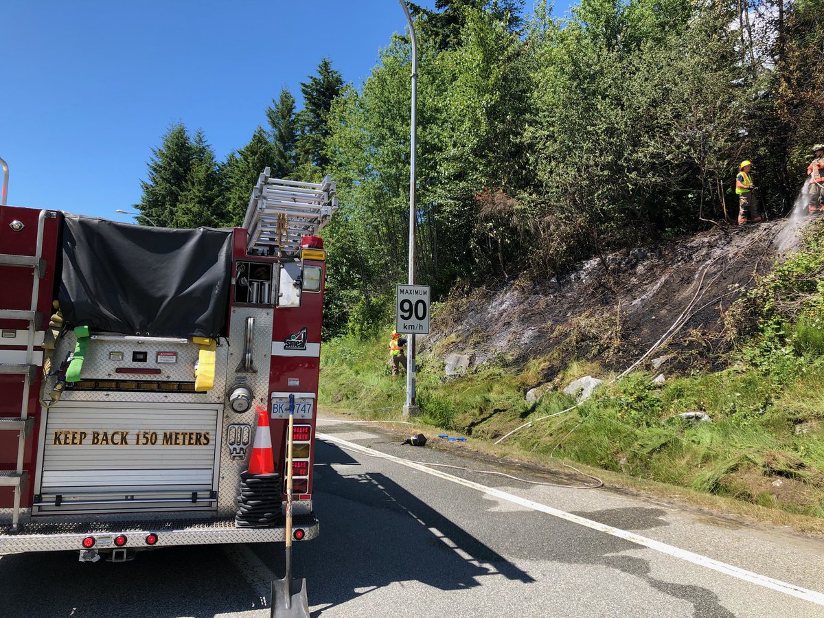 Crews extinguished a brush fire on the side of Highway 1 on Thursday. 