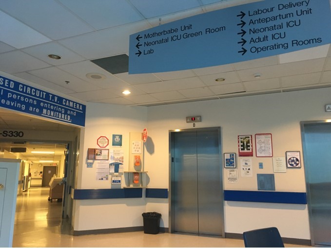 As her baby was being born via surrogacy at Victoria General Hospital, Sara waited near a set of elevators for news.