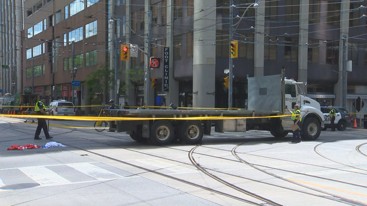 A woman has died after being hit by a truck in downtown Toronto Wednesday morning.