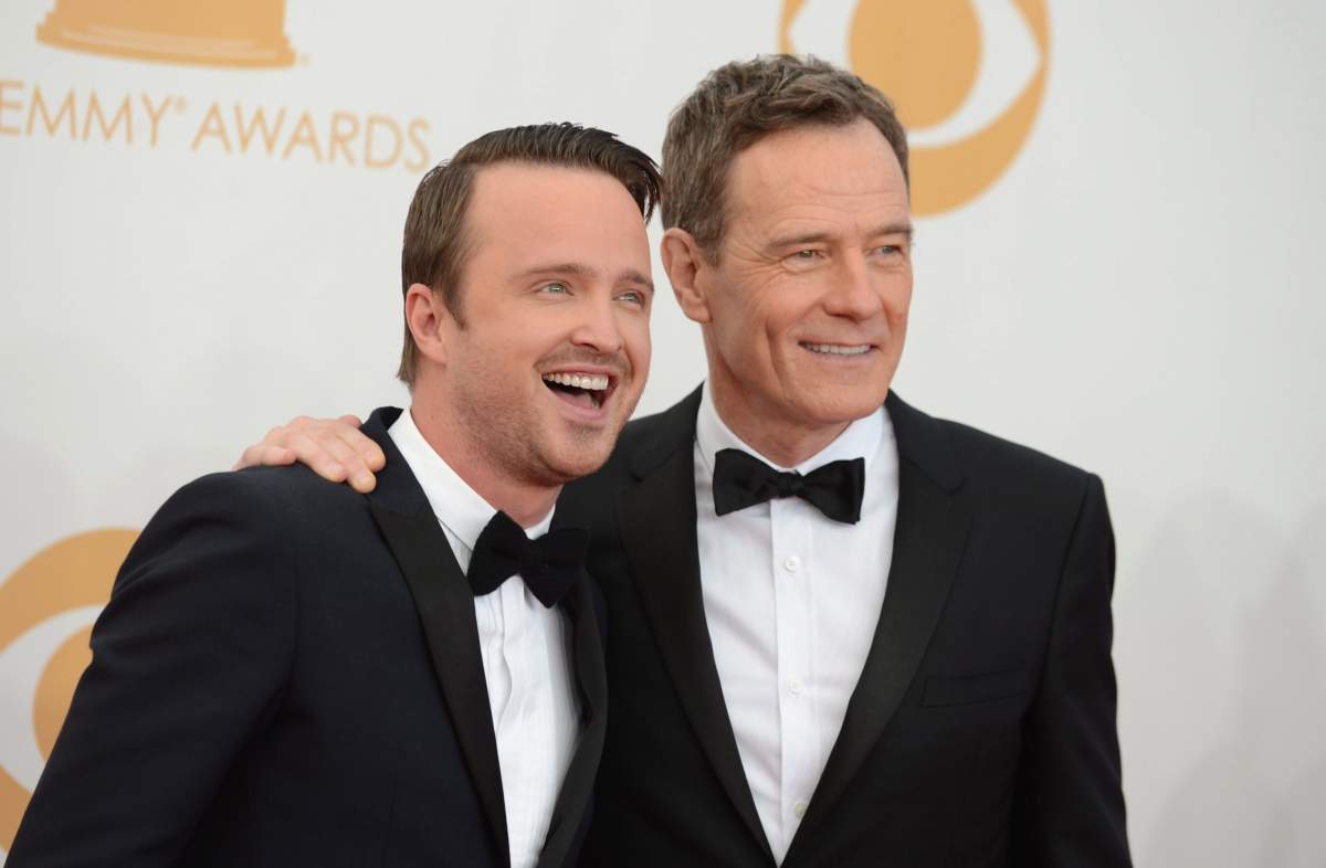Aaron Paul, left, and Bryan Cranston arrive at the 65th Primetime Emmy Awards at Nokia Theatre on Sunday, Sept. 22, 2013, in Los Angeles, Calif.